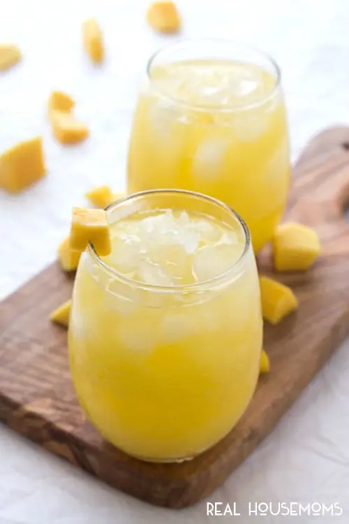 Mango sparkling water served with fresh mango